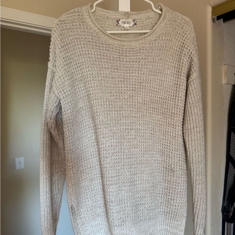 Tunic style sweater.